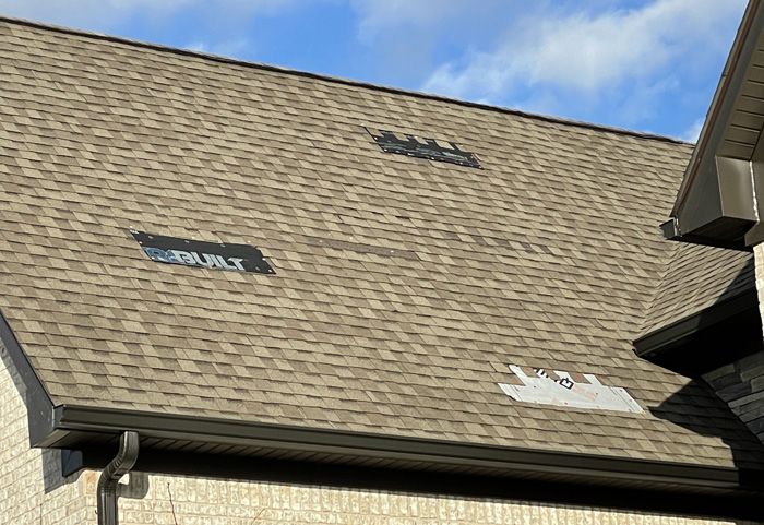 roof with temporary repair from wind damage