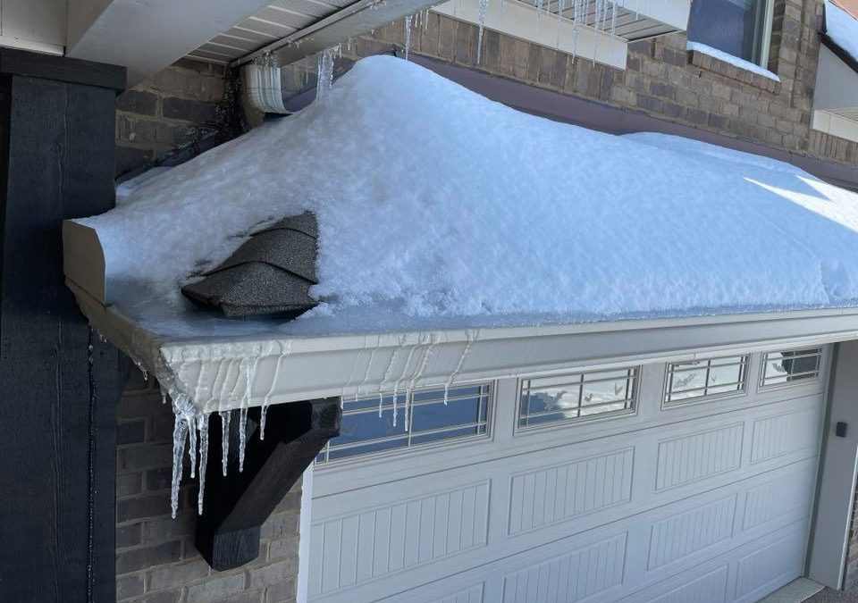 ice dam that leads to roof damage in winter